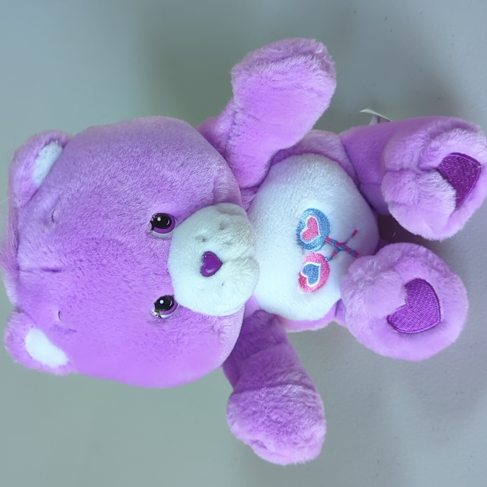 Care Bear, Share Bear, purple clapping plush stuffed animal.